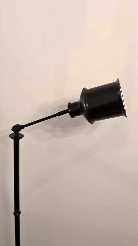 Black industrial tilting floor lamp