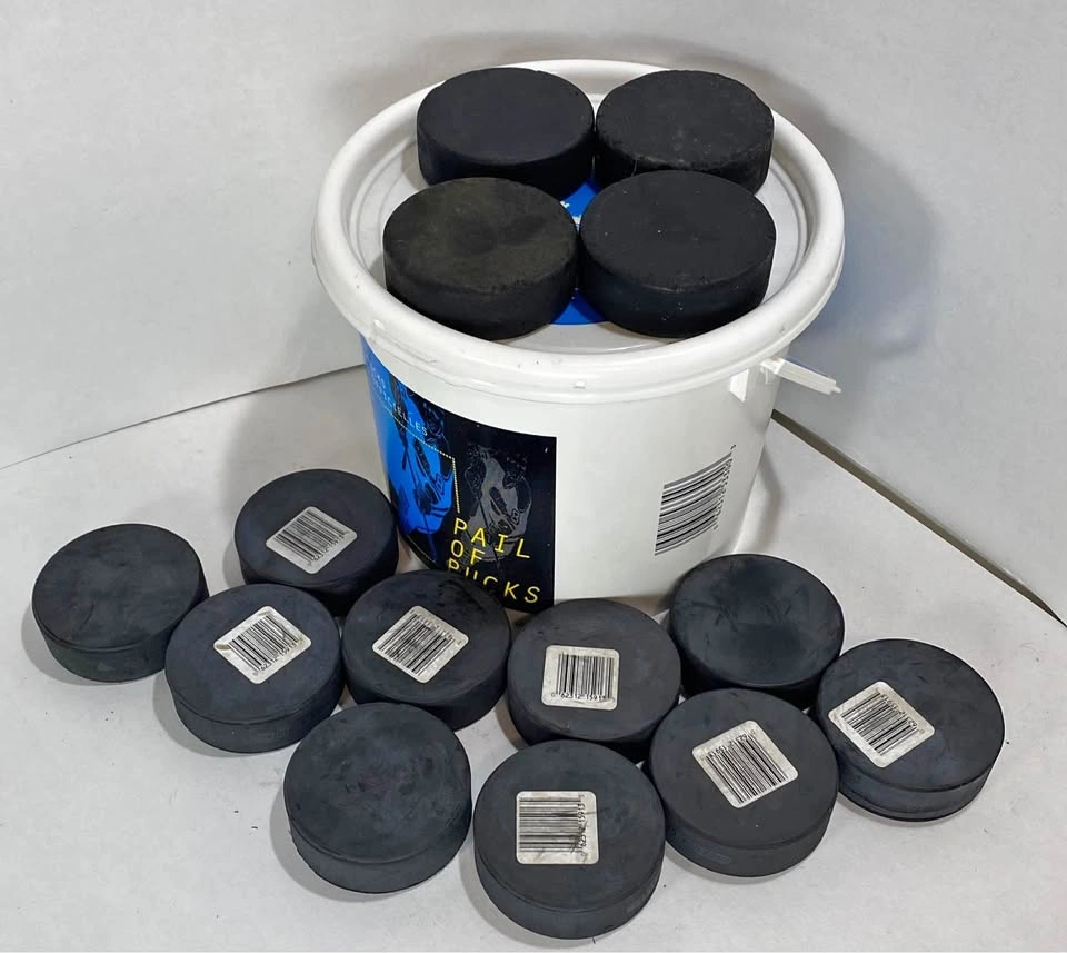 Pail of Hockey Pucks