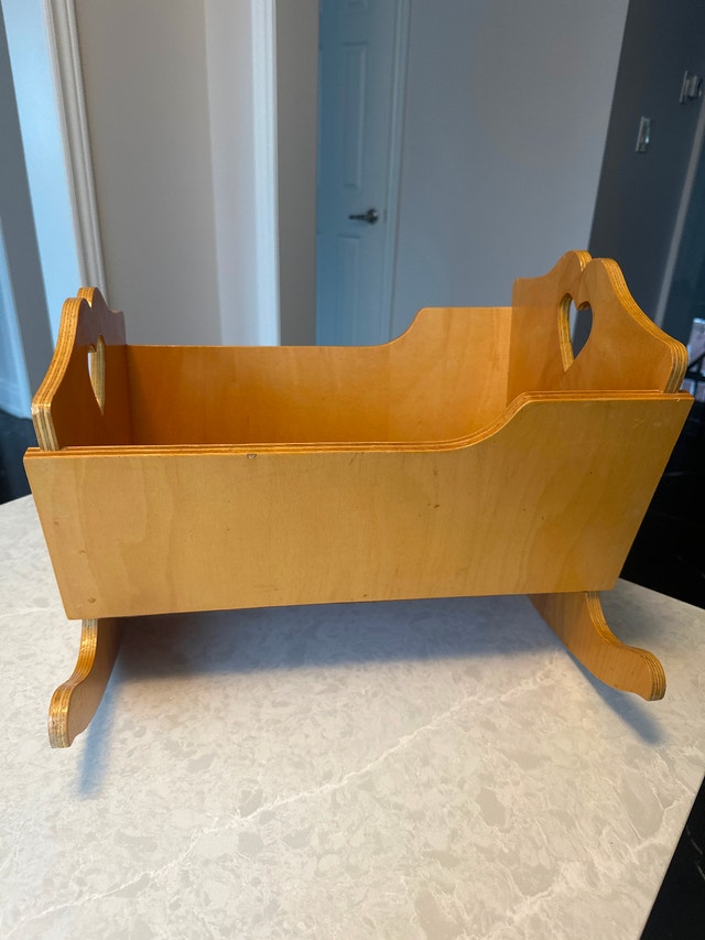 16” Wooden doll rocking cradle with heart-shaped cutout handles.