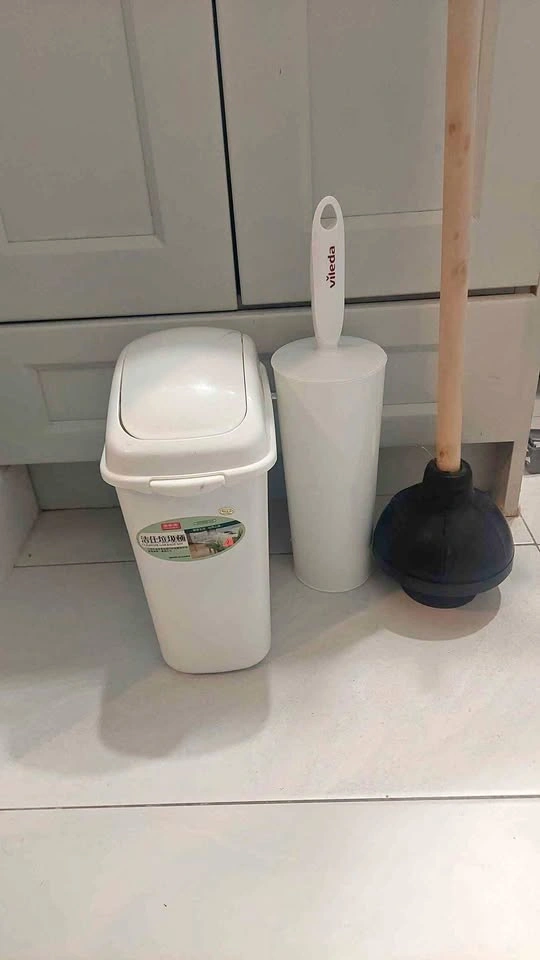 White Vileda Toilet Brush, Plunger, and Trash Can