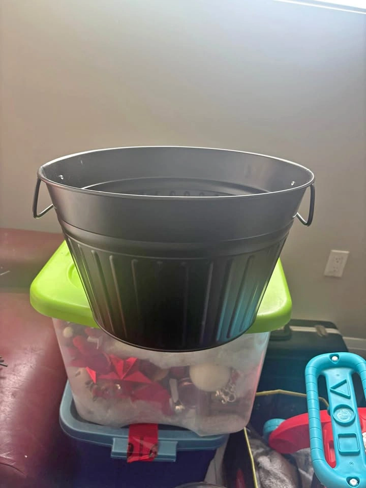 Large black metal bucket
