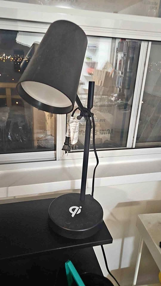 Lamp with wireless charging at base