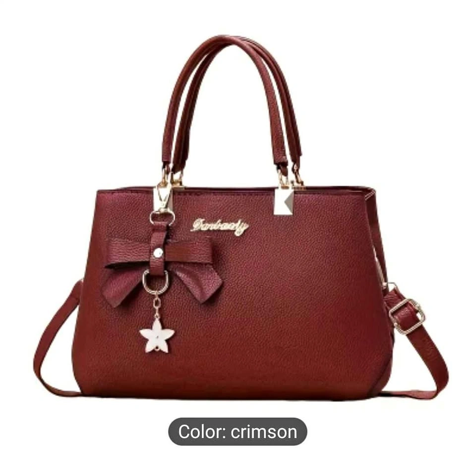 Brand new beautiful maroon color stylish handbag with star charm