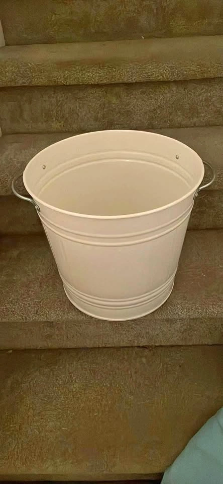 Creme colored metal bin 12” tall, 11” wide, good clean condition