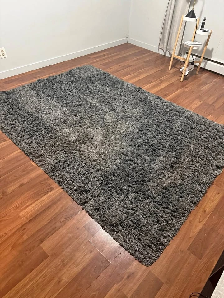 Large dark grey shag rug