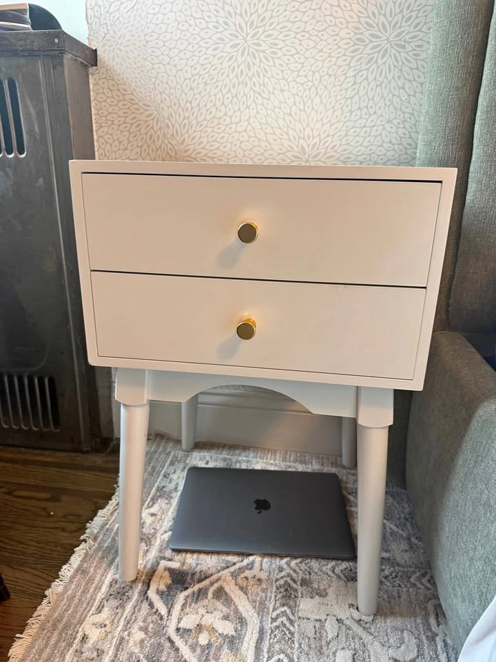 White nightstand with gold knobs