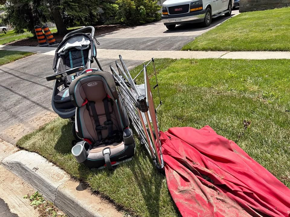 Free items on curb: Patio umbrella, clothing horse, stroller, ca