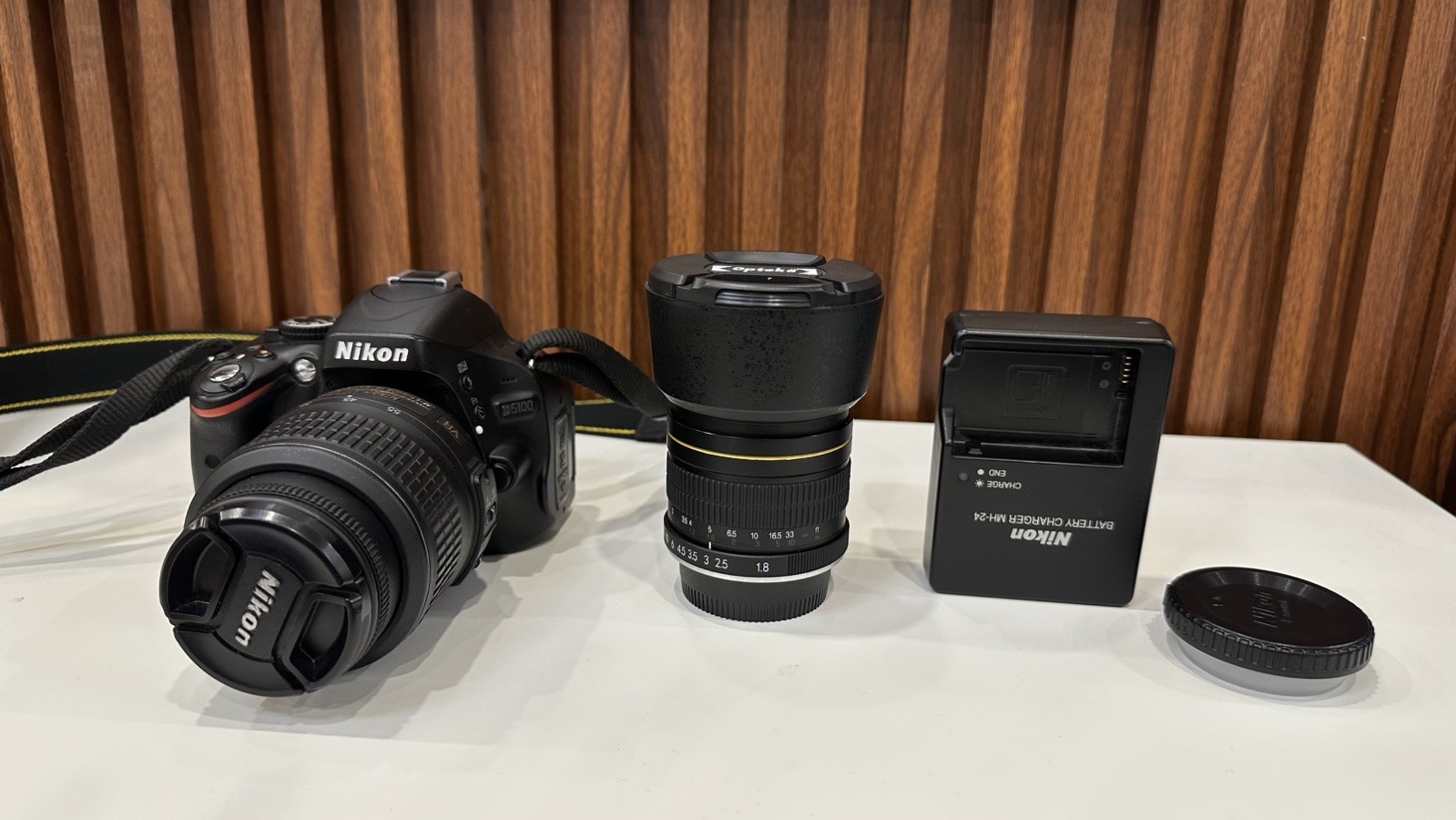 Nikon D5100 DSLR Camera + 18-55mm VR Lens + Opteka 85mm f/1.8