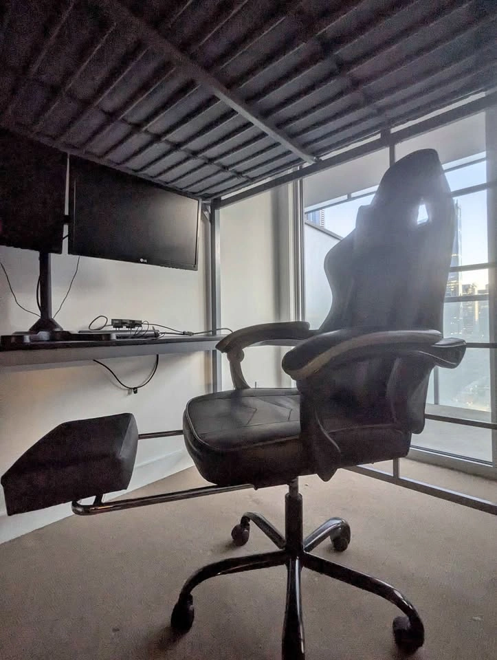 Gaming chair with lumbar support and footrest