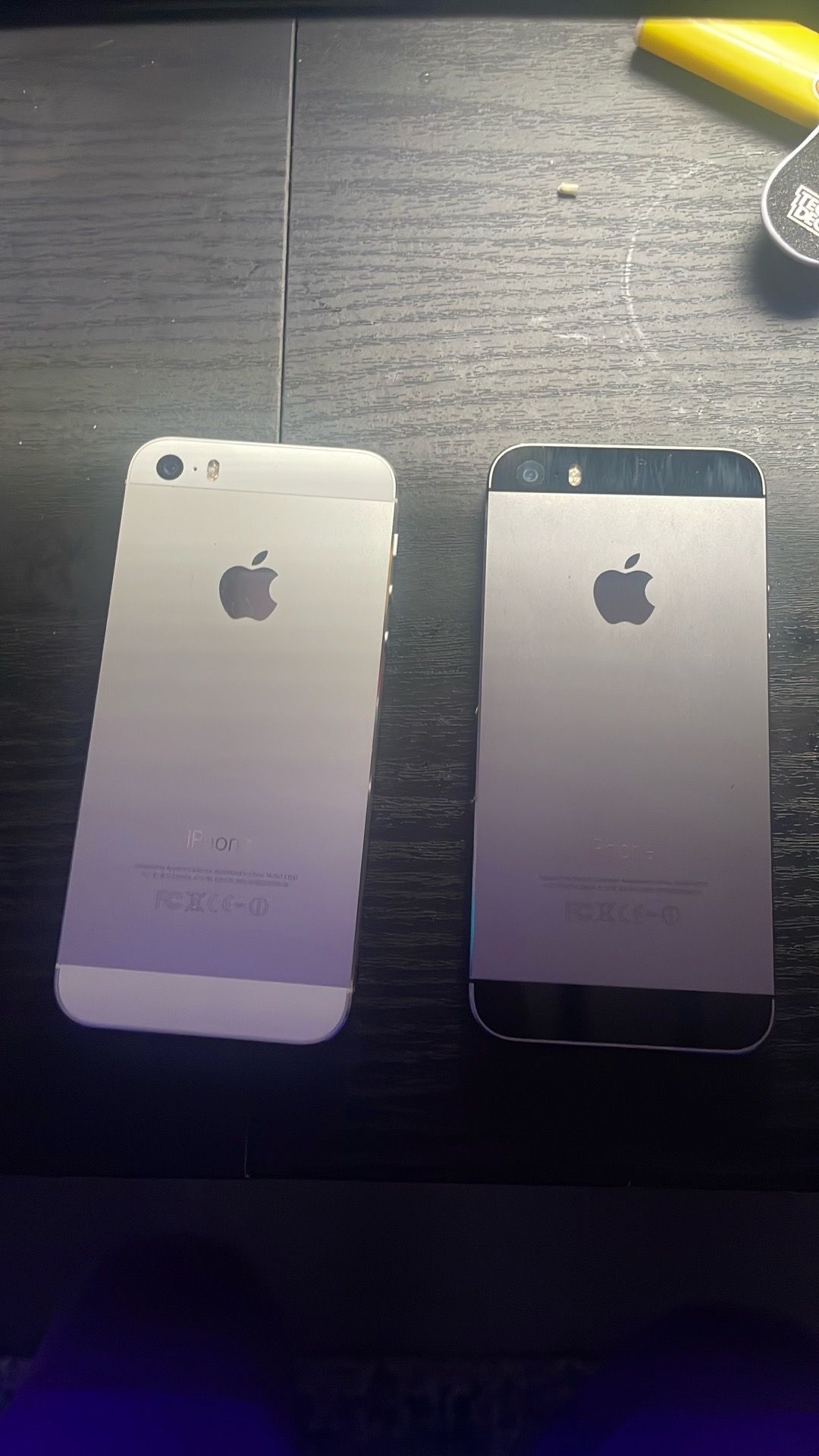 2 Old iPhones - 1 Grey/Black, 1 White/Grey