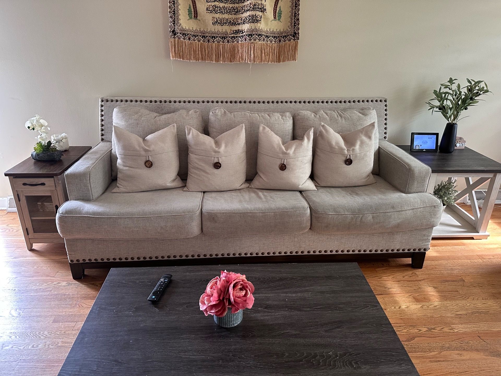 Beige couches with studded trim