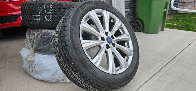 4 Bridgestone All-Season Tires 235/50 R18 with Ford Rims
