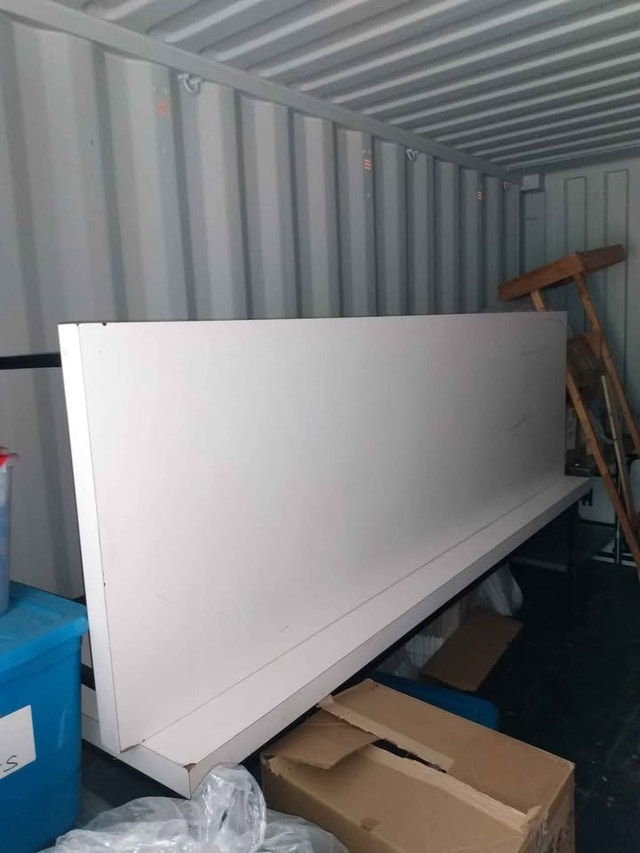 Heavy non-collapsible white laminate table with steel legs