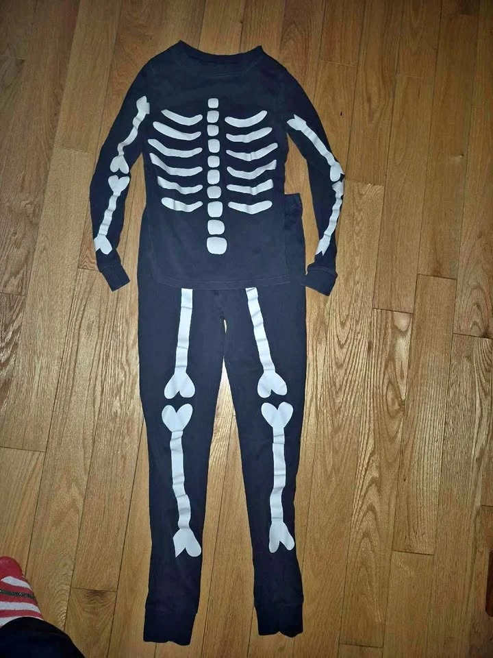 Skeleton PJs (glow in the dark) size 14