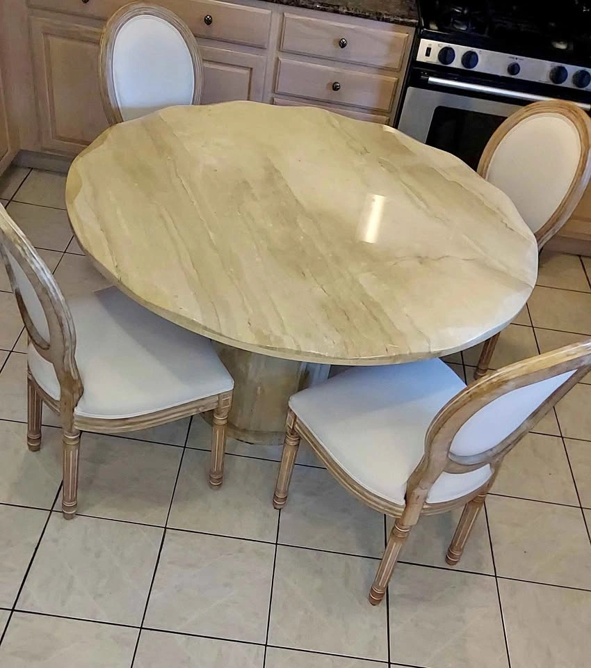 Solid marble table with beveled edges and 4 chairs