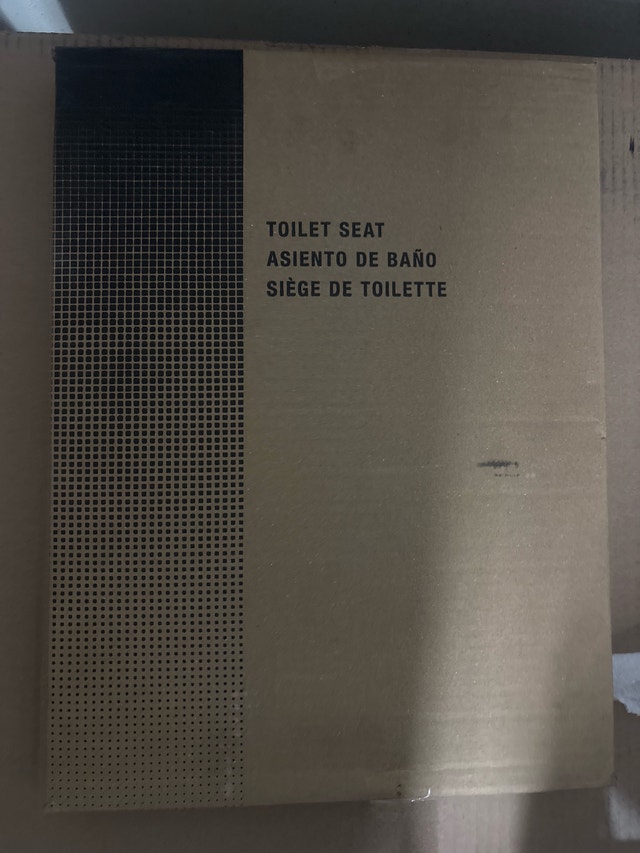 new in the box elongated toilet seat
