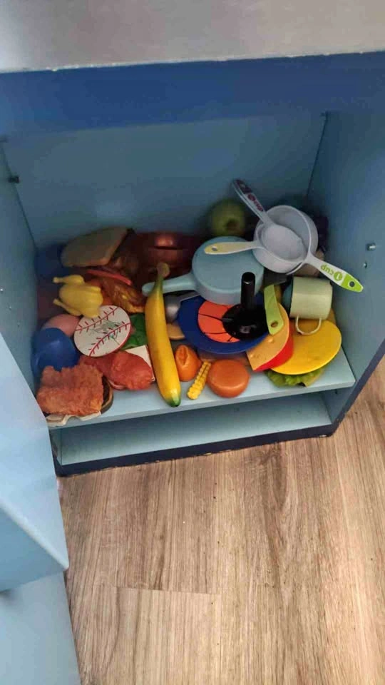A bunch of toy food and plates