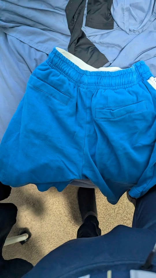Bright blue shorts with white zippers - photo 2