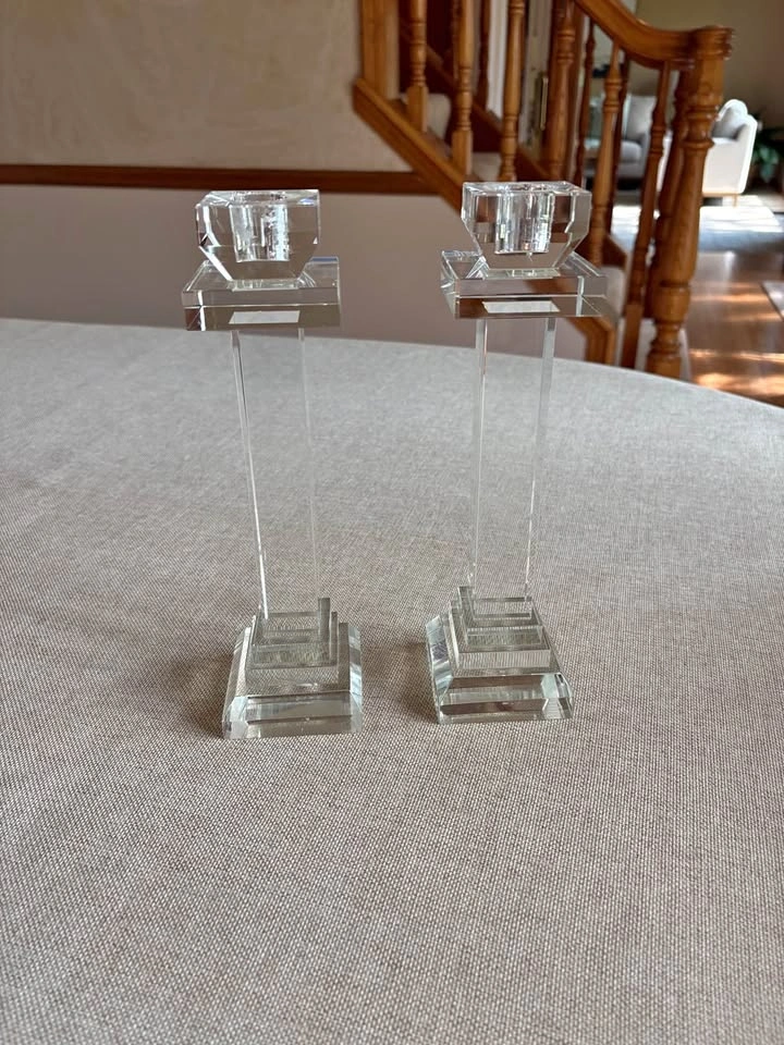 Two tall crystal candlestick holders