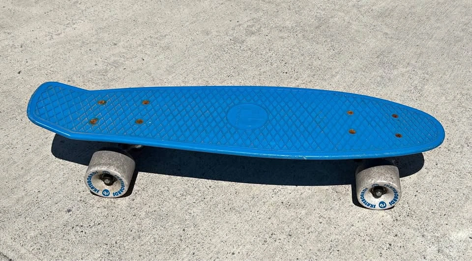 Blue Penny-style Skateboard