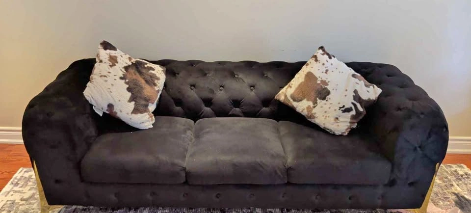 Tufted black velvet three seater sofa and a love seat