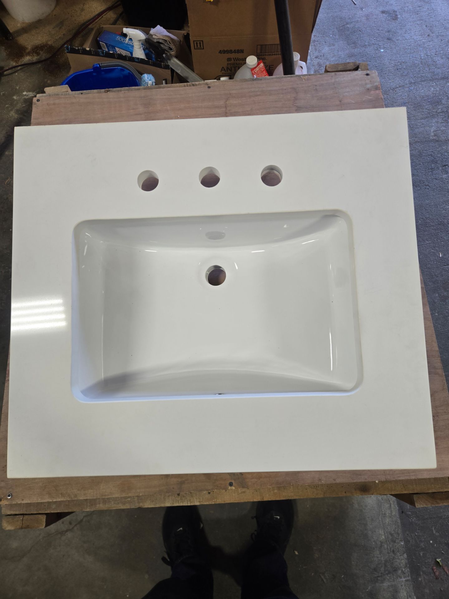 New white Quartz countertop with mounted porcelain sink