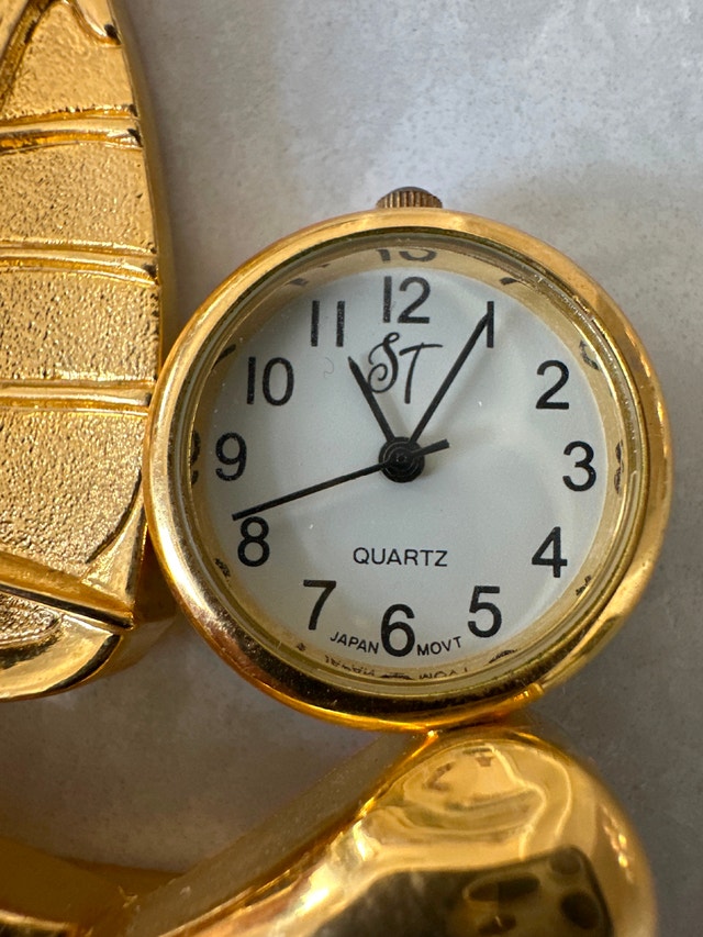 Vintage miniature gold quartz desk clock featuring a windsurfer - photo 5