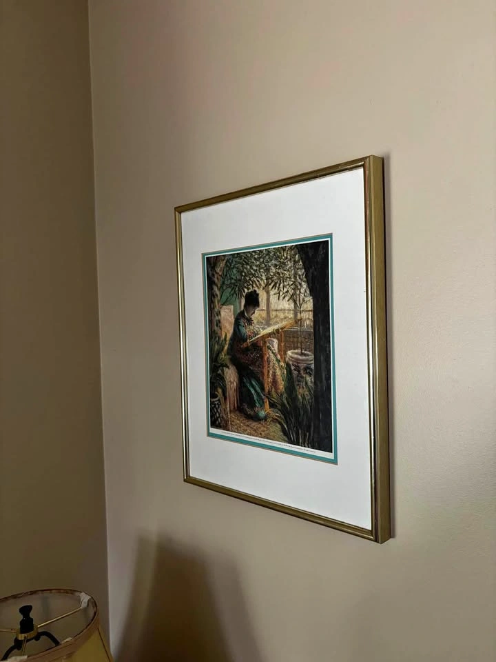 Claude Monet Woman Embroidering Framed Art Print