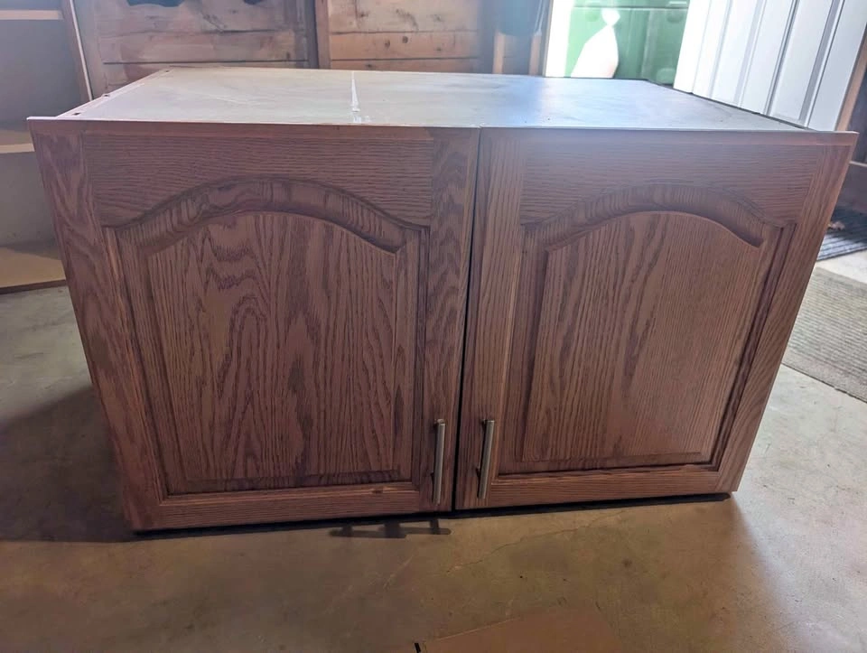 Deep over fridge upper oak cabinet