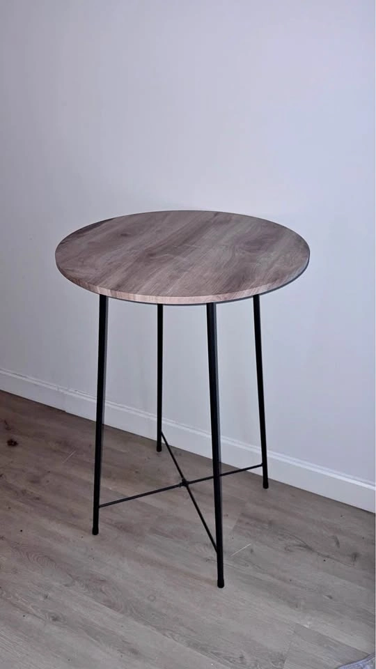 Round wood look table with black metal legs