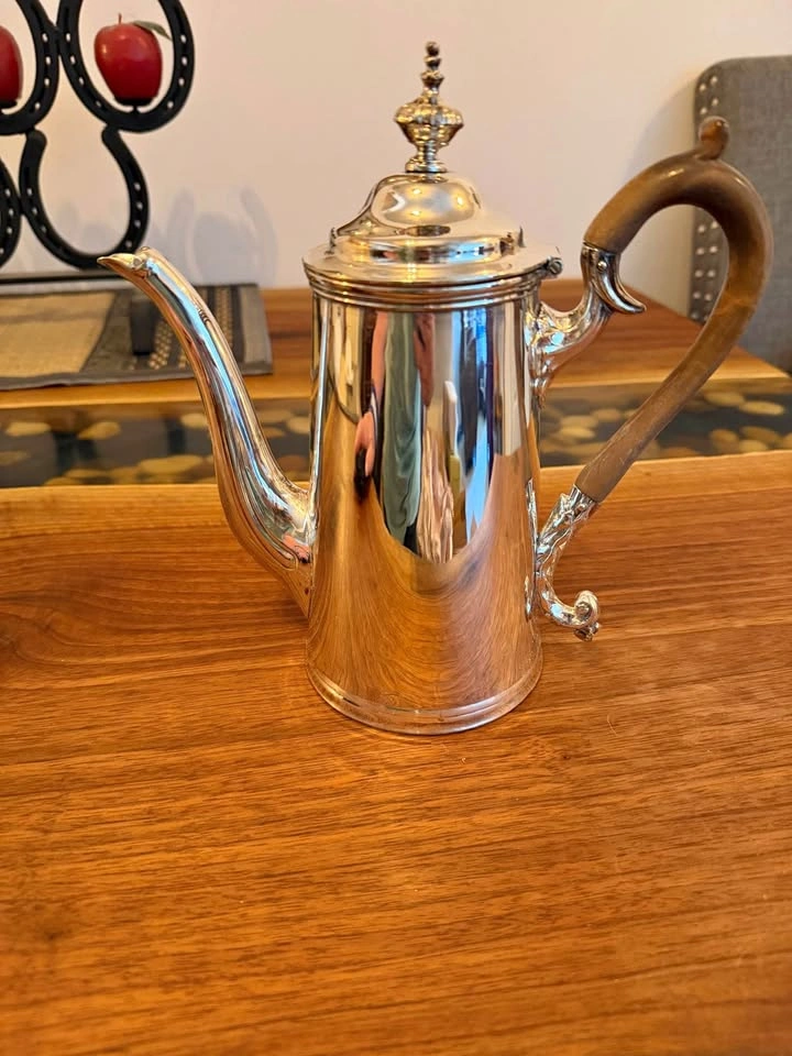 Pretty silver plated tea pot with carved wooden handle