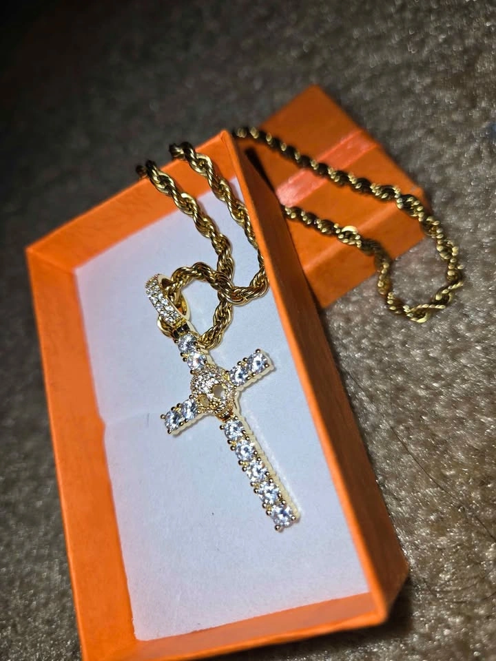 Gold chain with a cross-shaped pendant and a skull covered in zi - photo 5