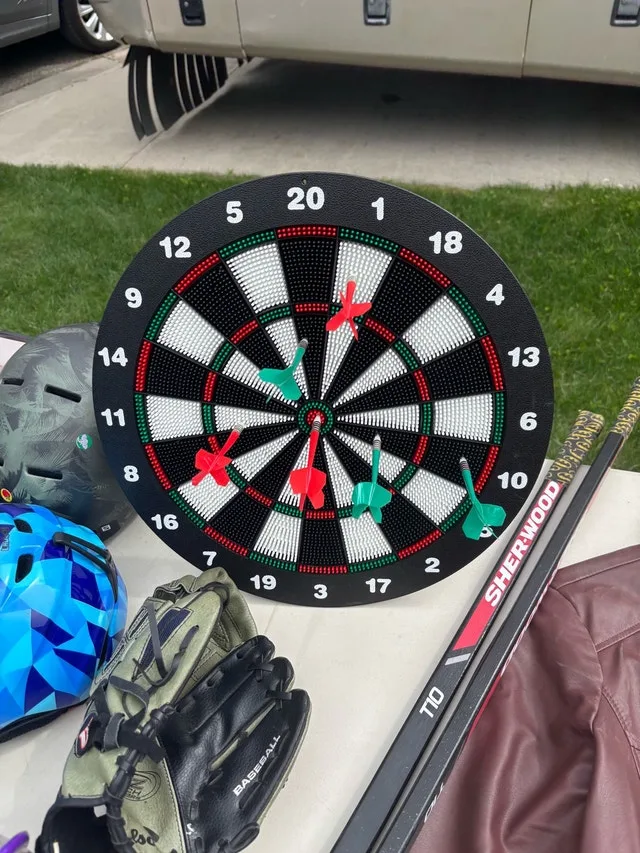 Dartboard, glove, puzzle game, and helmets