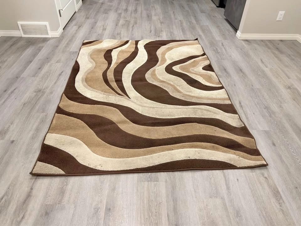 Area rug brown beige cream wavy pattern