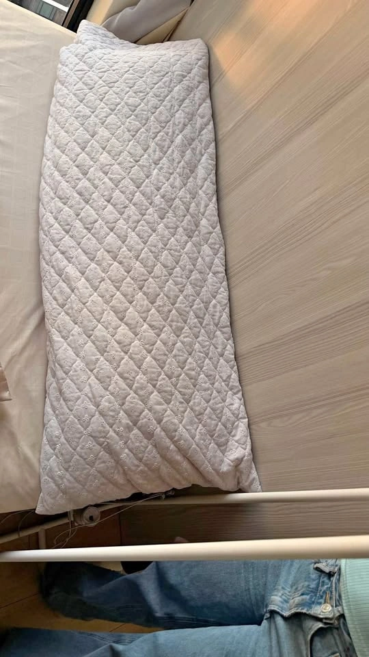 White quilted body pillow with pillow case