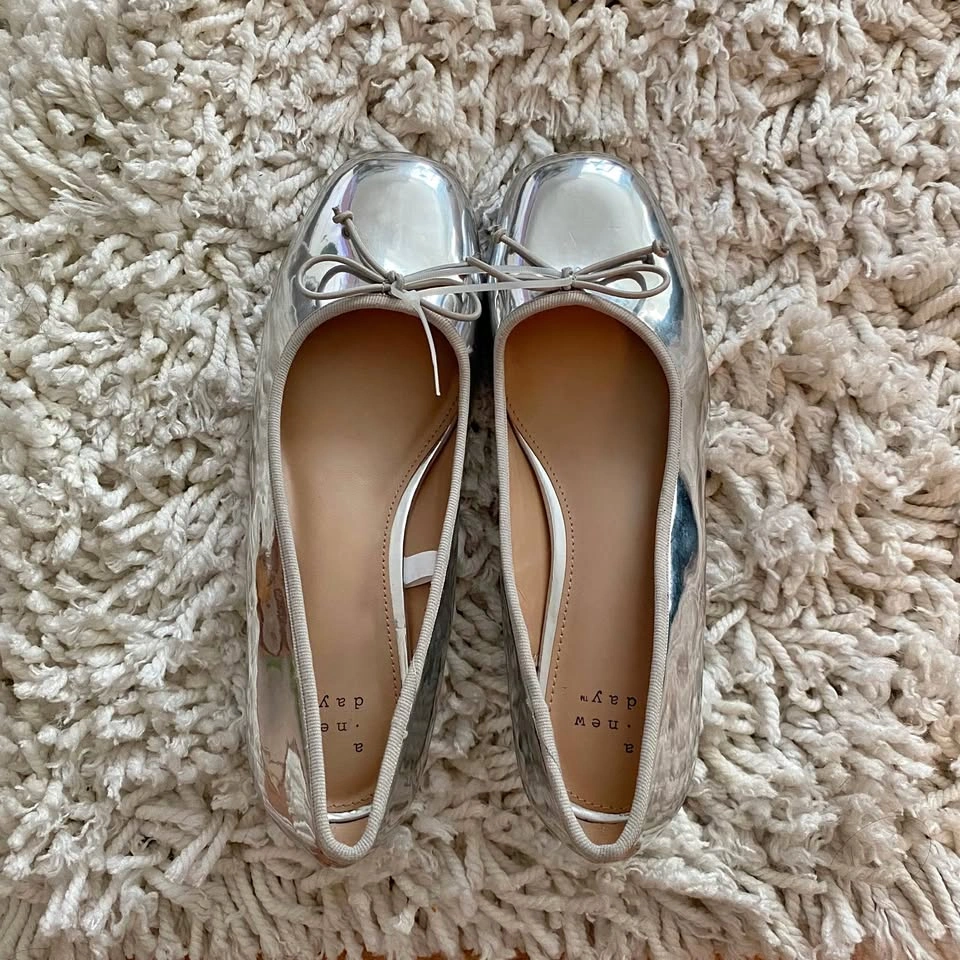 A New Day silver heels with a bow
