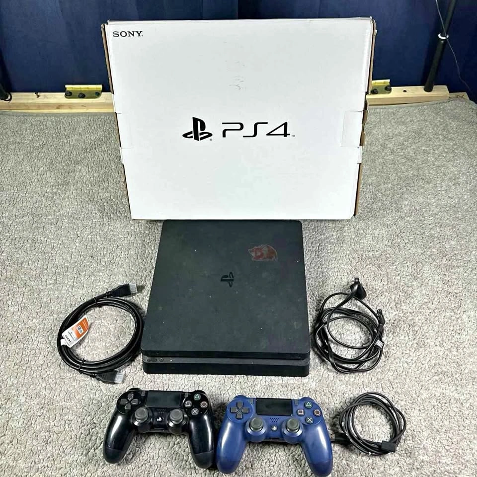 Sony PS4 slim 1tb console with 2 controllers and cables