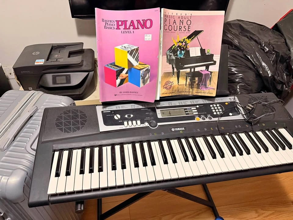 Yamaha Electronic Keyboard with Stand and Piano Books