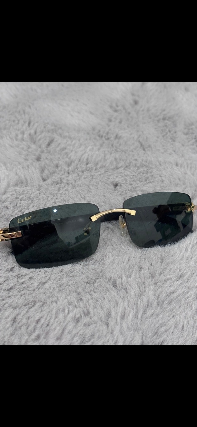Cartier green tint/black buff glasses