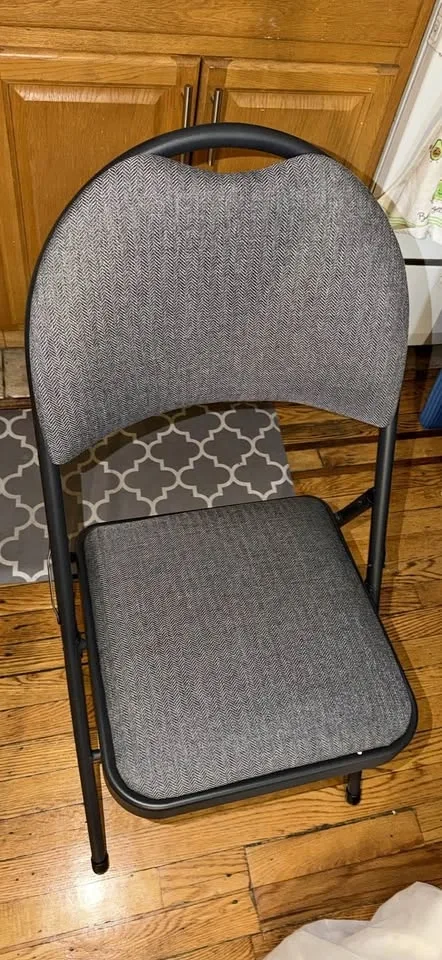 Two padded foldable chairs