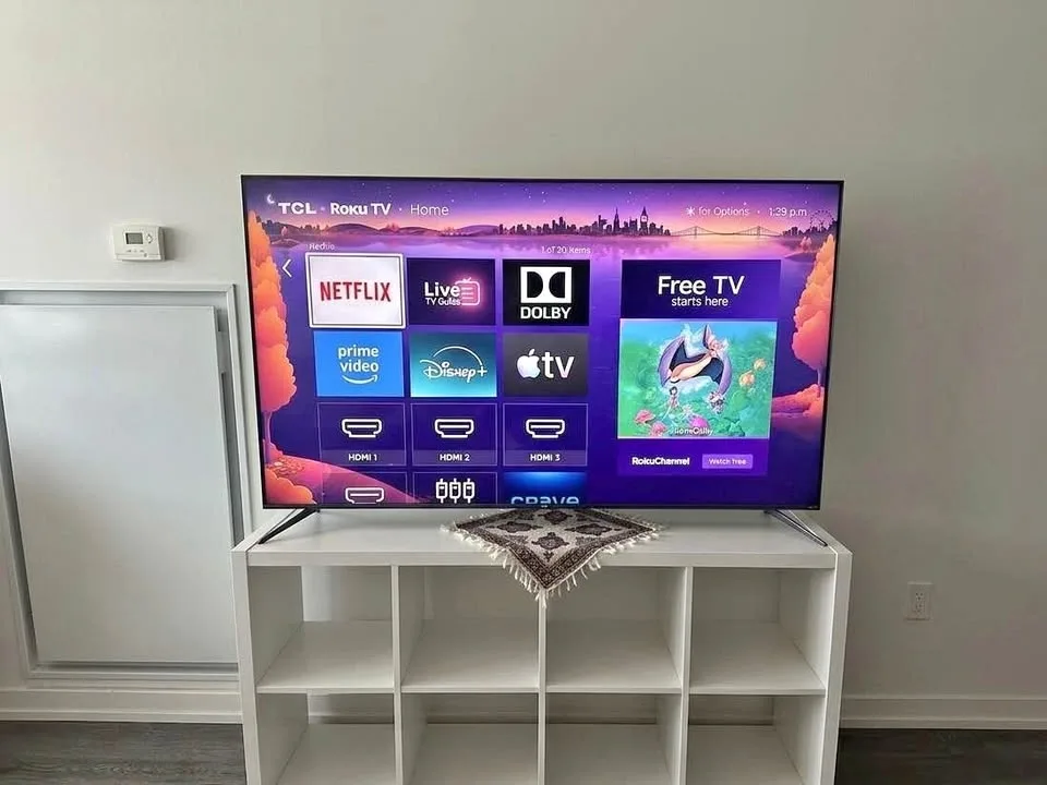 TCL 65 inch 5-Series QLED Roku TV and TV Stand