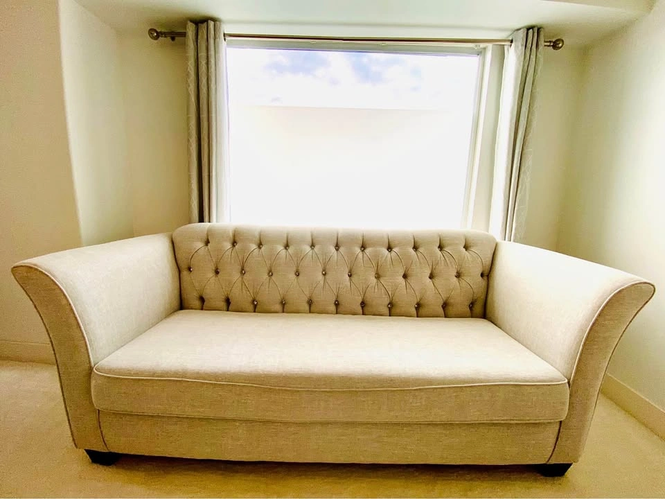 Designer-inspired Wings tufted sofa
