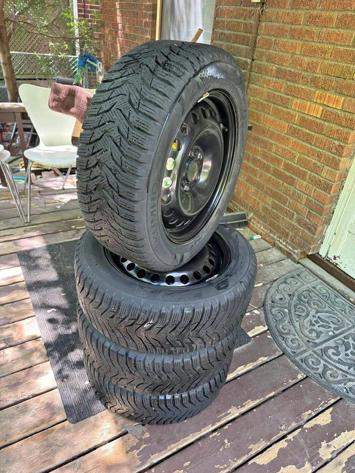 4 Kumho Winter Tires 215/55R16 on Black Steel Rims - 95% Tread