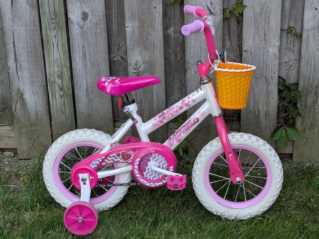 Girl's first bike, training wheels, handlebar, basket, pink seat
