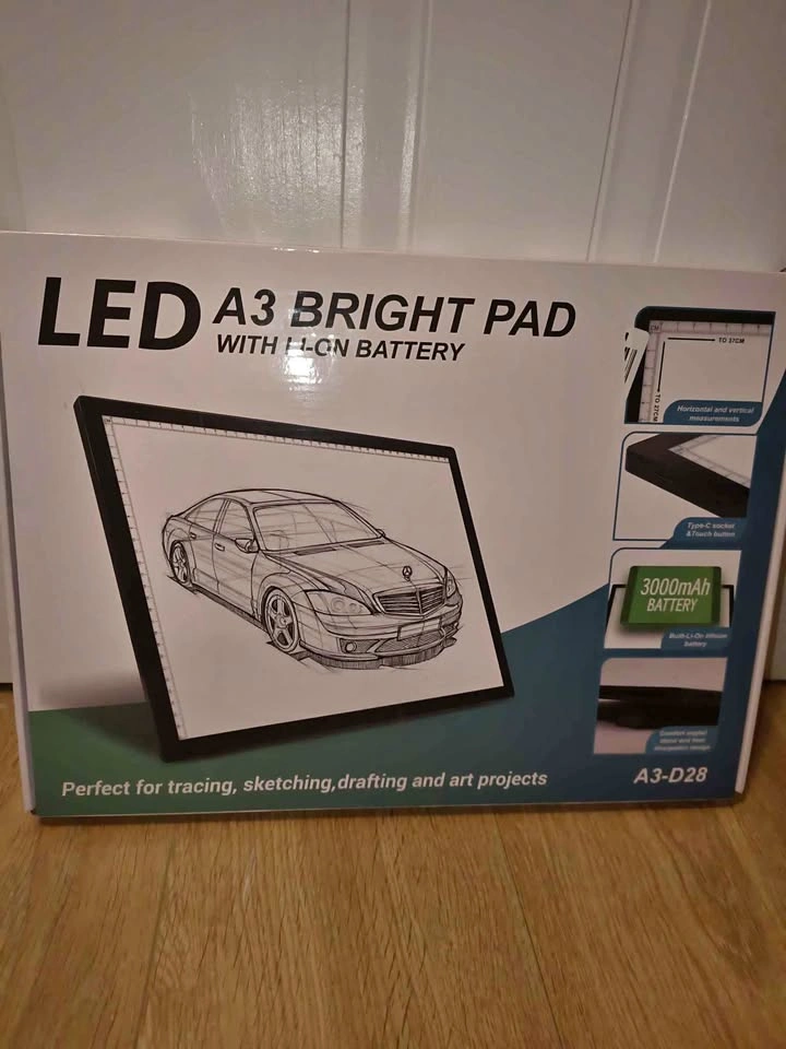 New in Box. Light pad with stand.