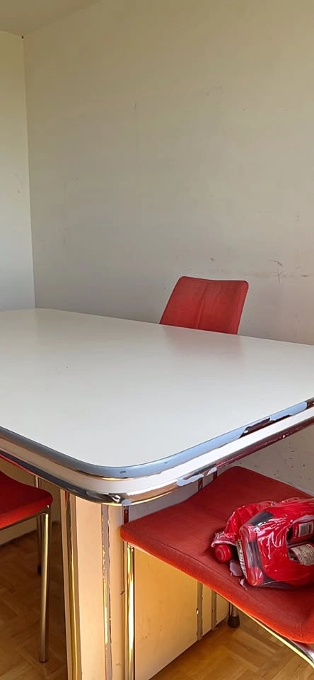 White Dining Table with Red Chairs