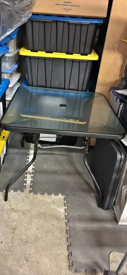 Outdoor glass table. Round square