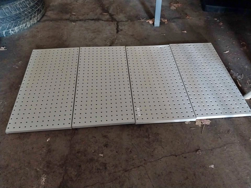 4 pegboards and several hooks