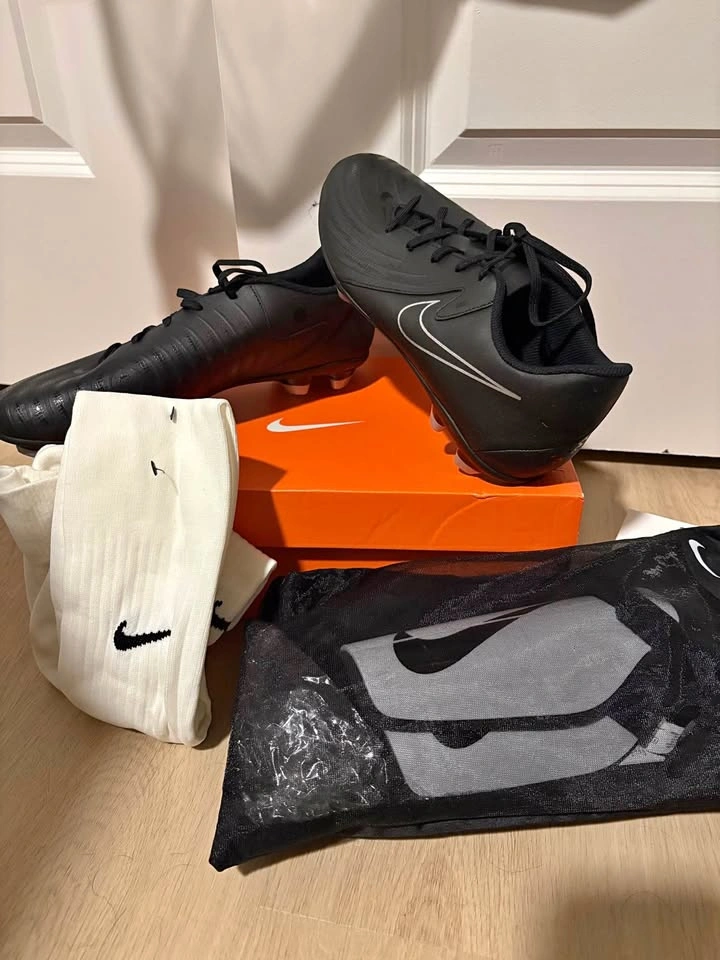 Soccer cleats with socks and pads