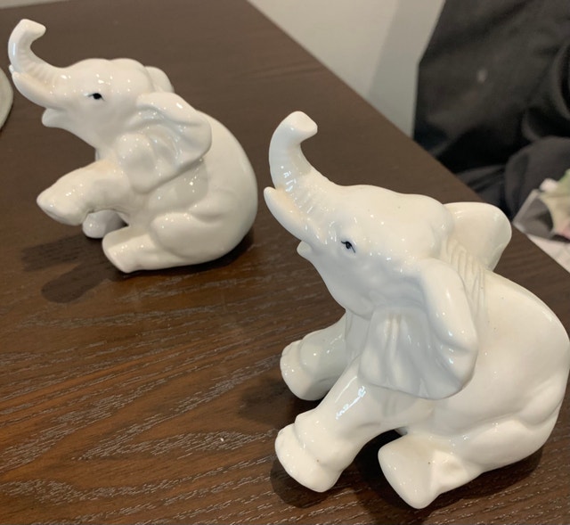 Two small glass white elephants
